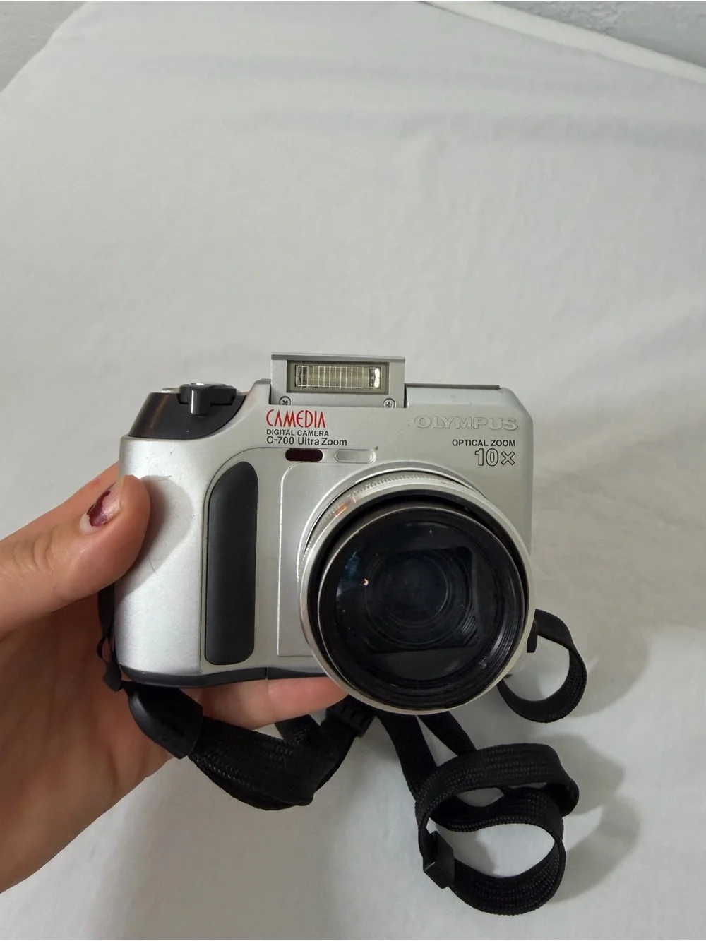 Olympus Silver Compact Digital Camera with Black Wrist Strap